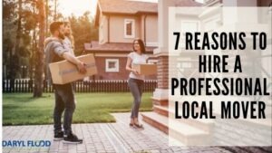man and woman carrying boxes into new home